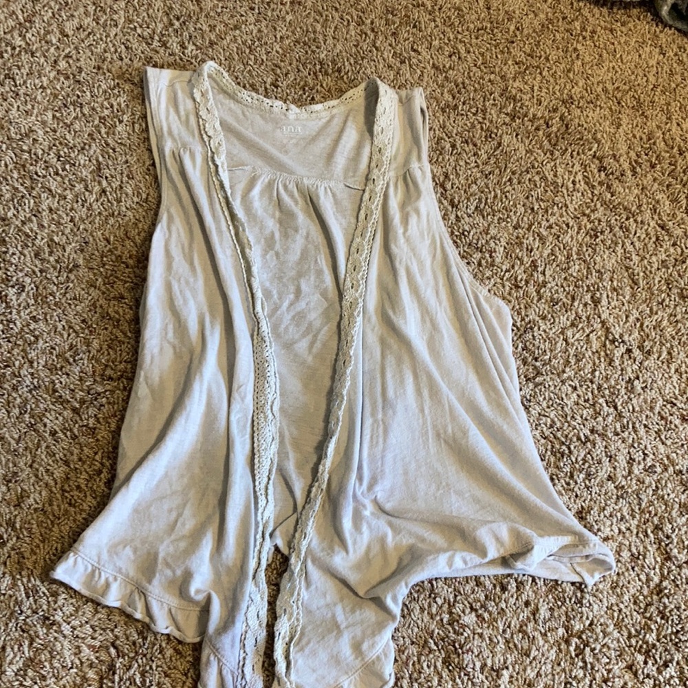 Cream colored sleeveless cardigan